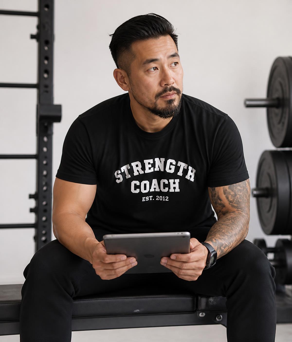 Marcus Ito reviewing client programming on a tablet in his studio